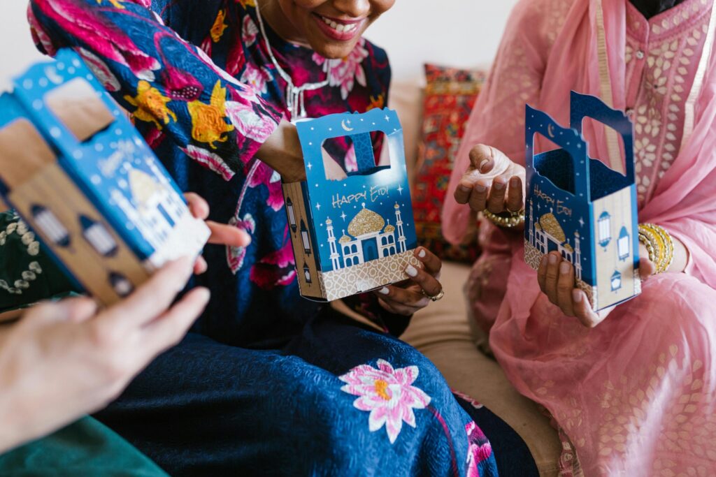 Photo Of Women Holding Gift Boxes